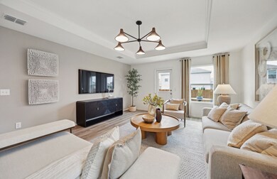 Airy gathering room showcases open concept floorplan *Model representation
