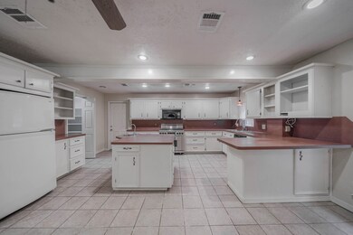 Kitchen has convenient access to the Garage for unloading supplies, plus nearby Walk-In Pantry.