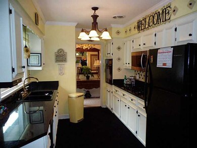 Kitchen. Granite surrounds and wraps around into t