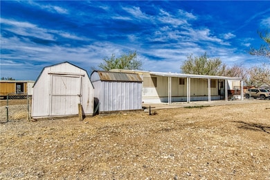 View of shed with fence