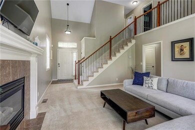 2nd story hallway banister is open to livingroom