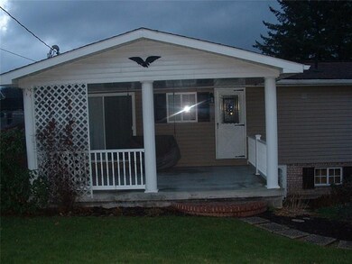 Private concrete flooring covered back porch