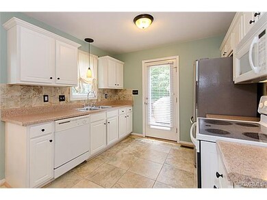 Kitchen with Tile Floor and Tile Backsplash