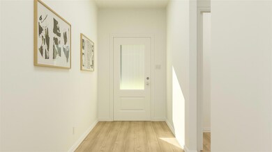 Doorway with light hardwood / wood-style floors