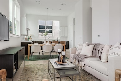 The bright and open floor plan makes it easy to stay connected with friends and family throughout the main living area.