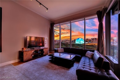 Living area with ornamental molding, healthy amoun