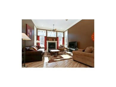 Oversized hearth room with maple hardwood floors