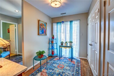 Sliding door to front deck, laundry closet + pantr