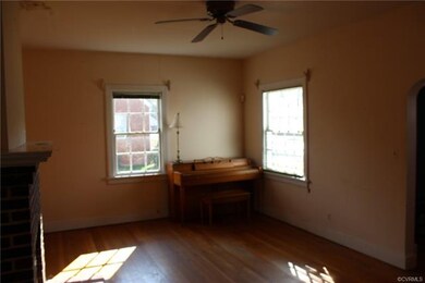 The living room has lots of natural light, hardwoo