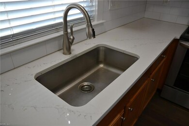 Quartz counters and title backsplash