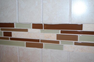 Ceramic tile backsplash in kitchen