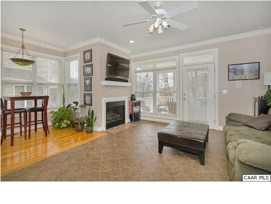 Living room with lots of windows and 8' ceilings