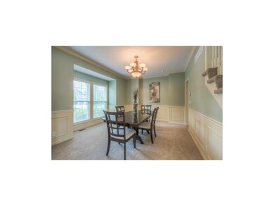 From the front entrance, this dining room is to yo