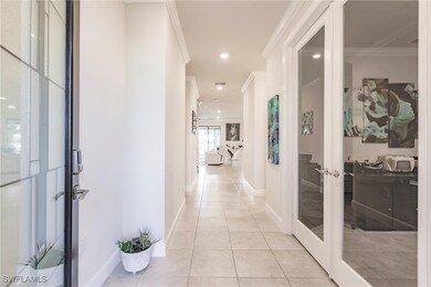 Corridor with light tile patterned floors, french