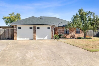 Ranch-style home with a front yard and a garage