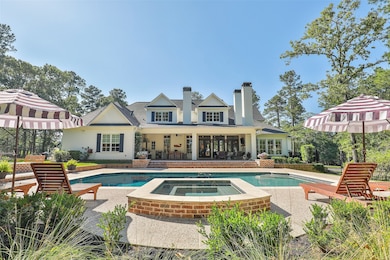 Beautiful backyard with spa, fire pit, outdoor kitchen and outdoor living area with additional fireplace accessible from family and kitchen area that is great for entertaining!!