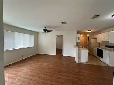 Kitchen featuring electric range, freestanding re