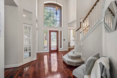 The interior features a neutral color palette for easy integration with any style. Laminate flooring runs throughout the first floor's main areas, and oversized windows flood the entryway with natural light.