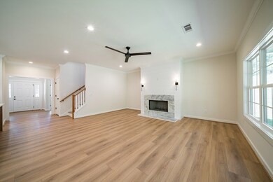 living room with wood burning fireplace