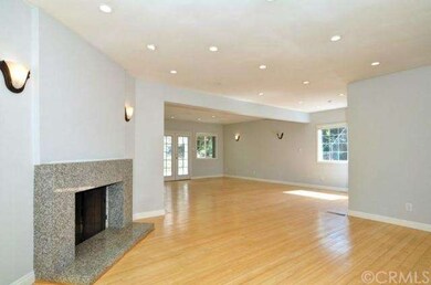 Great Room, granit flanked fireplace, custom light