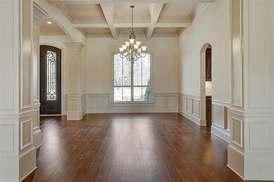 Full size dining room with coffer ceiling and wain