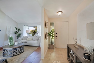 Entry foyer and view of living room