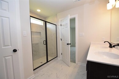 Bathroom with vanity and walk in shower