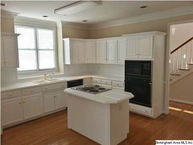 Sunny kitchen with center island.