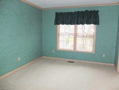 Formal dining room with crown molding.
