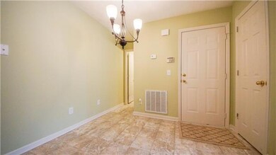 And a dining room just feet away from the oven is equipped an adorable light fixture, extra storage, a door to your ONE CAR GARAGE, and...