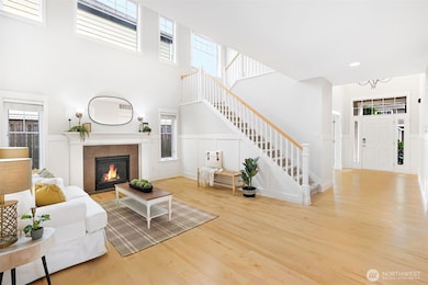 Spacious Living: Multiple decks, a light-filled interior, and a bonus room with a full bath offer ample space for family activities.