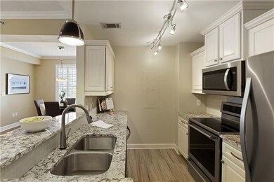 Quality white cabinetry with detailed trim & custom lighting