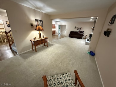 Hallway with carpet flooring