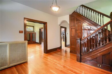 Entry way with judges paneling and custom wood sta