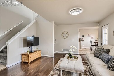 Step inside and be greeted by a spacious and inviting living area, adorned with large windows that flood the space with natural light.