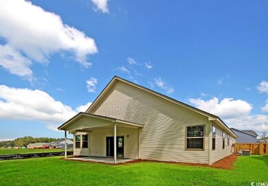 Rear view of property featuring a patio area