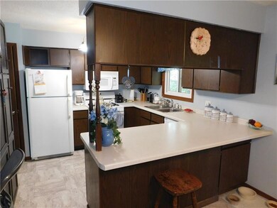 Kitchen Area With Breakfast Bar Seating!