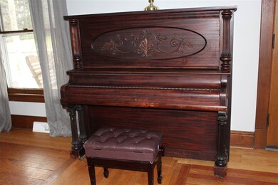 Piano is as old as the house and is included