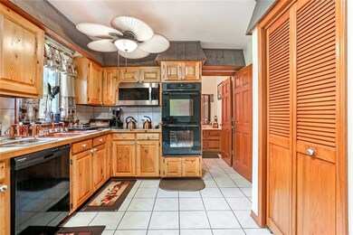 Kitchen with double ovens, microwave, dishwasher,