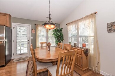 Dining Room with wood floor and upgraded chandelie