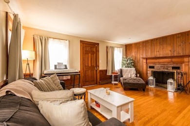 Living room with wood burning fireplace