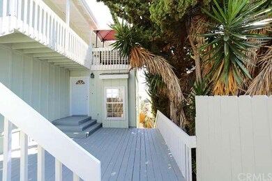 entrance to downstairs and stairway to upper unit.