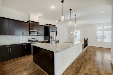 Open kitchen with dining area and living room.