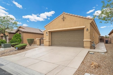 View of front facade with a gate, stucco siding, a