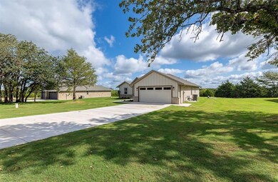View of front of home featuring a garage and a fro