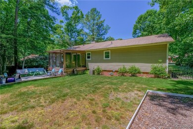 Back of house with an outdoor hangout area, a sunr