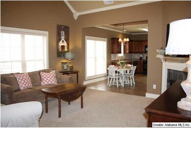 Large, open den with tall ceilings, gas fireplace