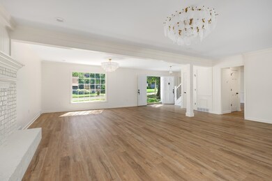 Unfurnished living room with hardwood / wood-style