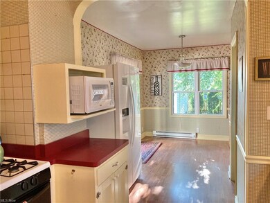 First floor addition! Including: breakfast room or office, powder room, sliding doors to deck ~ Backyard view from double windows ~