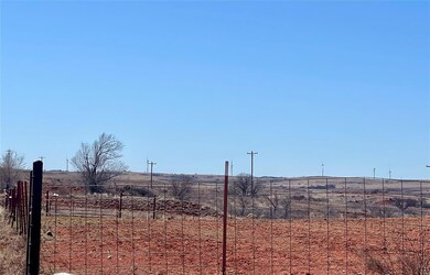 View of land with a rural view and fence